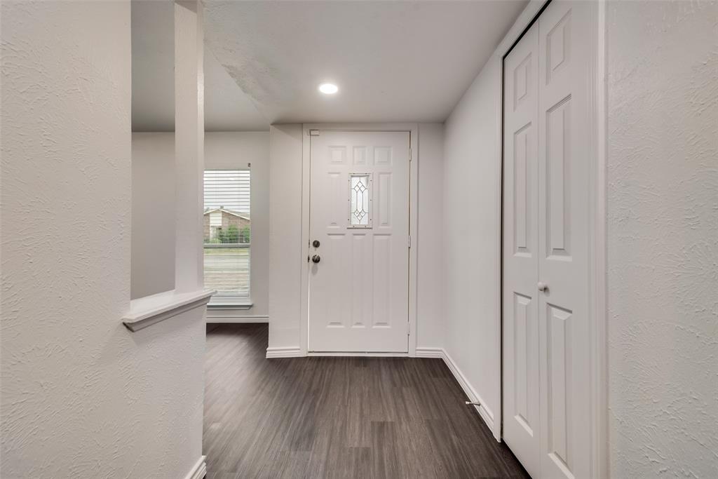 5412 Rice Drive The Colony, TX 75056 - Photo 3 of 17 a view of entryway with wooden floor