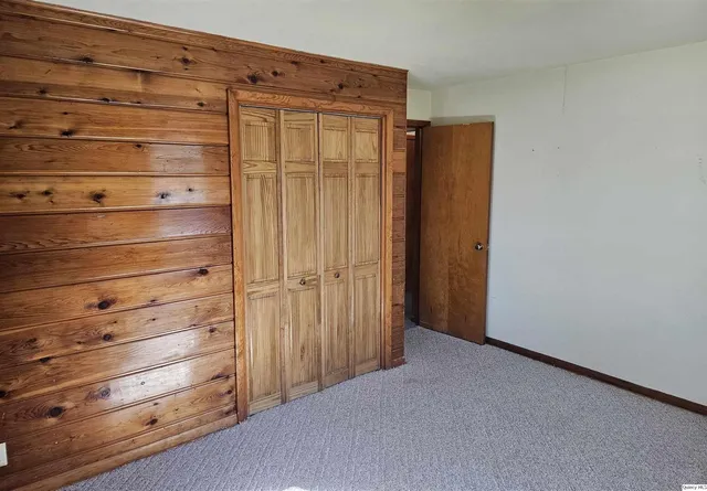a view of room with window and bathroom