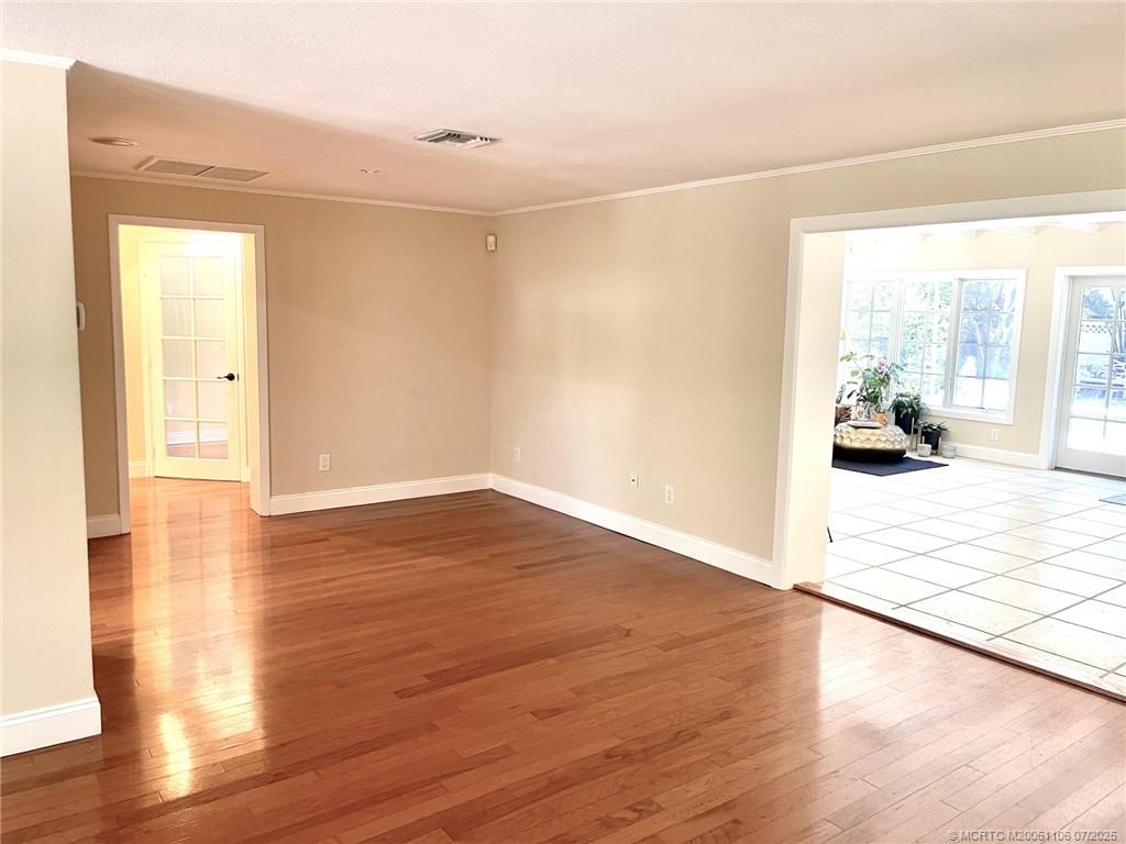4 Emarita Way Stuart, FL 34996 - Photo 28 of 47 a view of an empty room and wooden floor