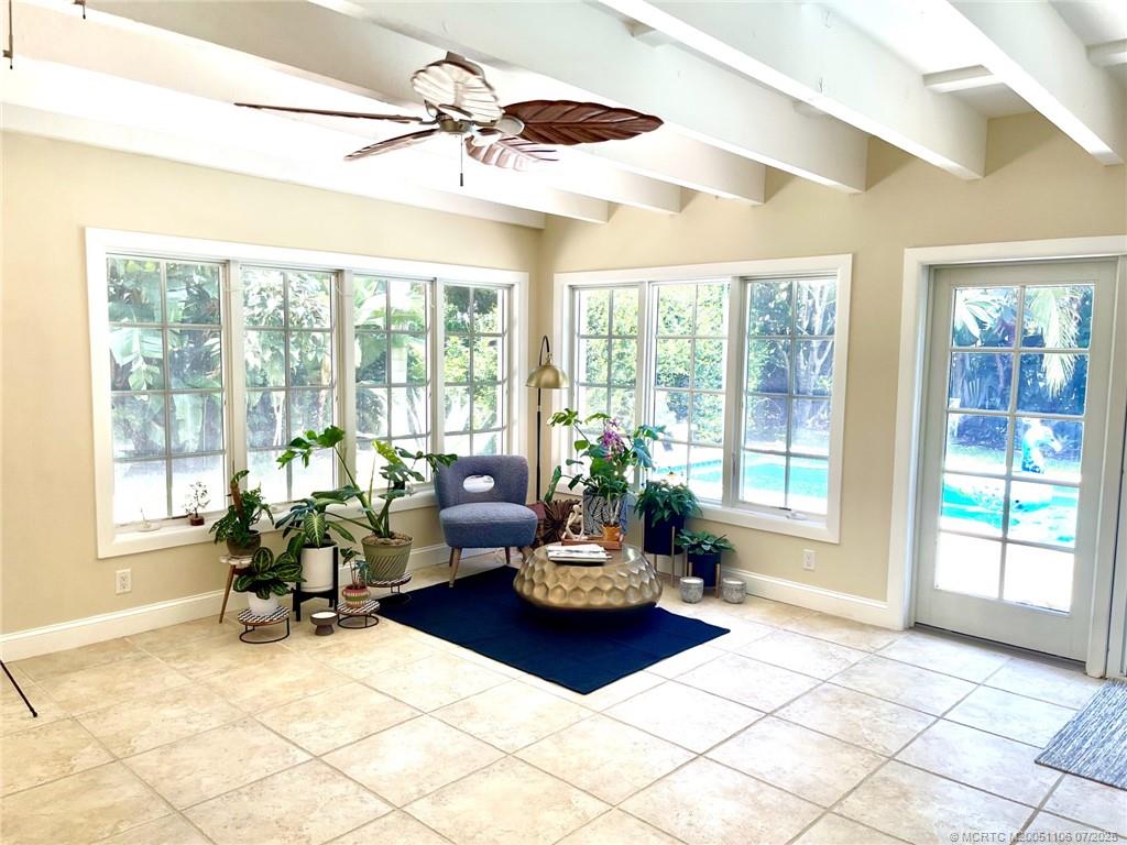 4 Emarita Way Stuart, FL 34996 - Photo 29 of 47 a living room with furniture and floor to ceiling windows