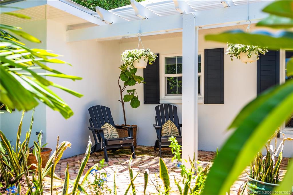 4 Emarita Way Stuart, FL 34996 - Photo 4 of 47 a front view of a house with garden