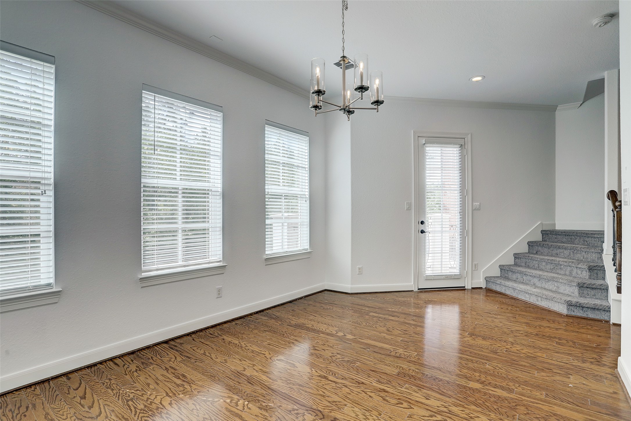 10 Shell Port Square The Woodlands, TX 77380 - Photo 11 of 31 wooden floor in an empty room with a window