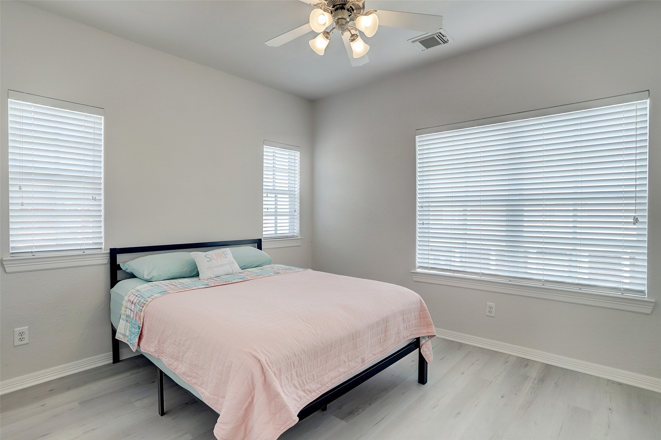 10 Shell Port Square The Woodlands, TX 77380 - Photo 26 of 31 a bedroom with a large bed and a window