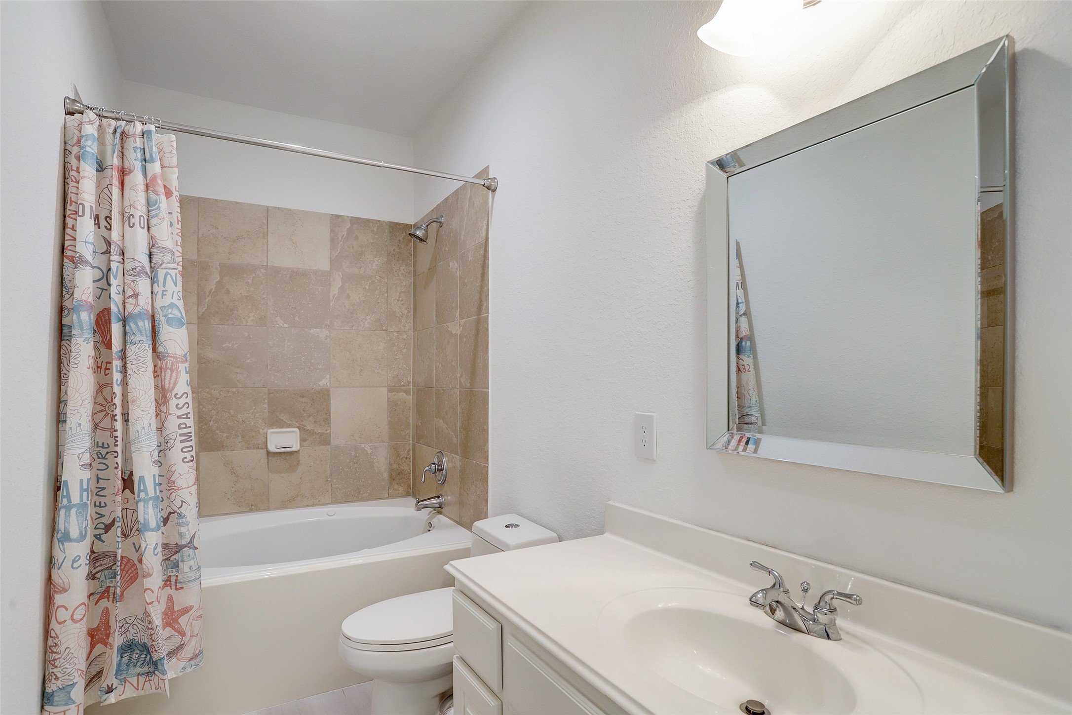 10 Shell Port Square The Woodlands, TX 77380 - Photo 28 of 31 a bathroom with a bathtub shower sink vanity mirror and toilet