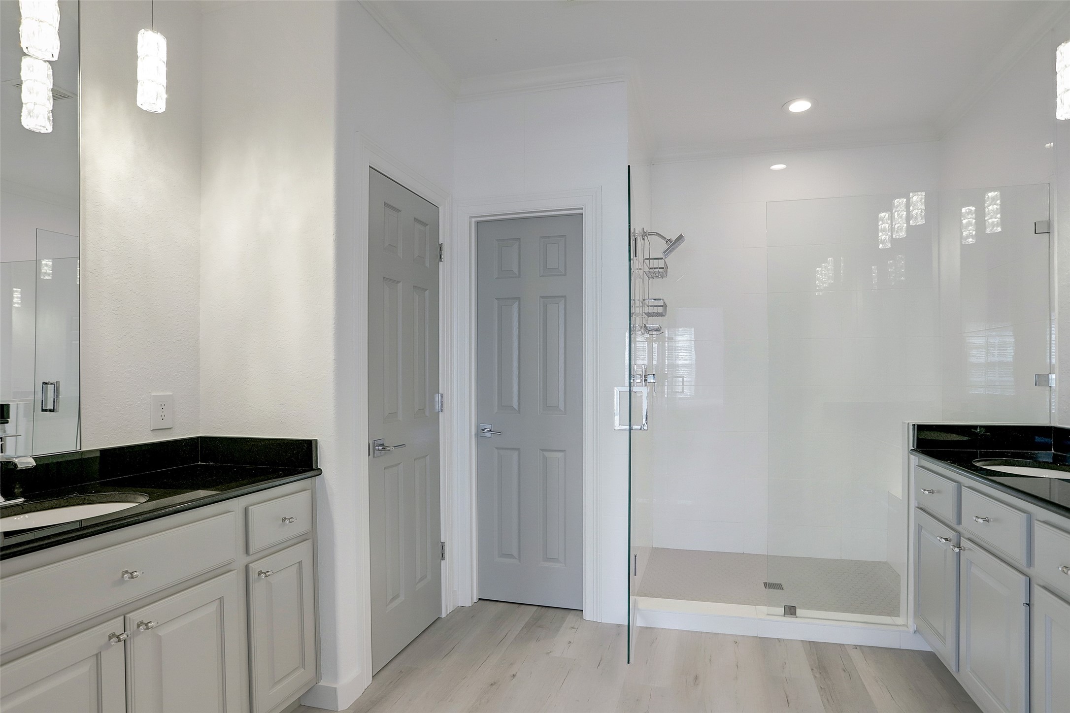 10 Shell Port Square The Woodlands, TX 77380 - Photo 4 of 31 a bathroom with a sink and a shower