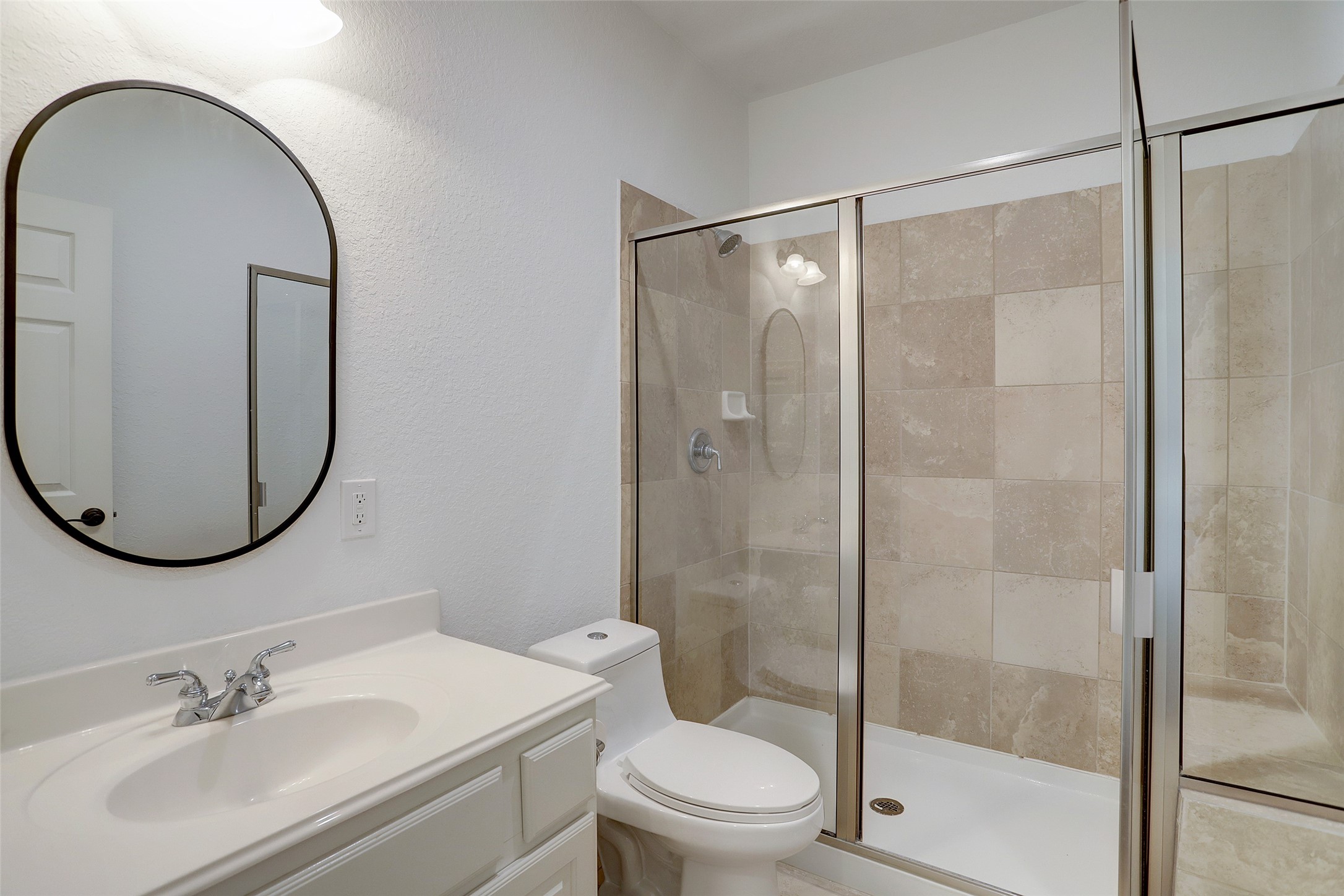 10 Shell Port Square The Woodlands, TX 77380 - Photo 9 of 31 a bathroom with a sink toilet and shower