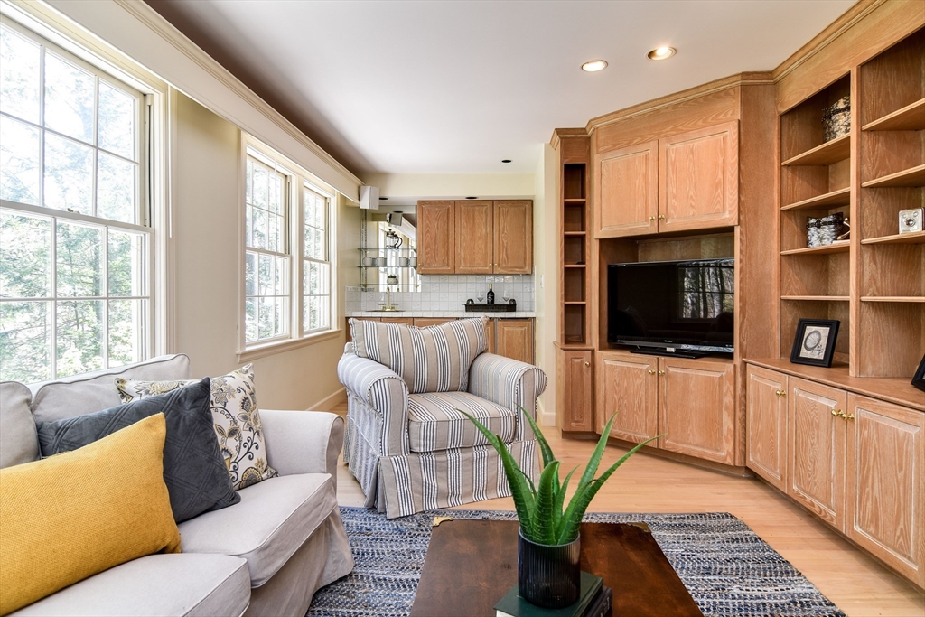 9 Buttercup Lane Dover, MA 02030 - Photo 1 of 36 a living room with furniture a flat screen tv and a window