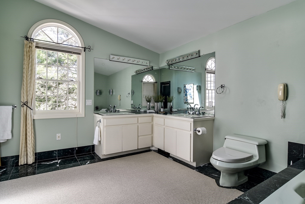 9 Buttercup Lane Dover, MA 02030 - Photo 13 of 36 a bathroom with a toilet a sink and mirror