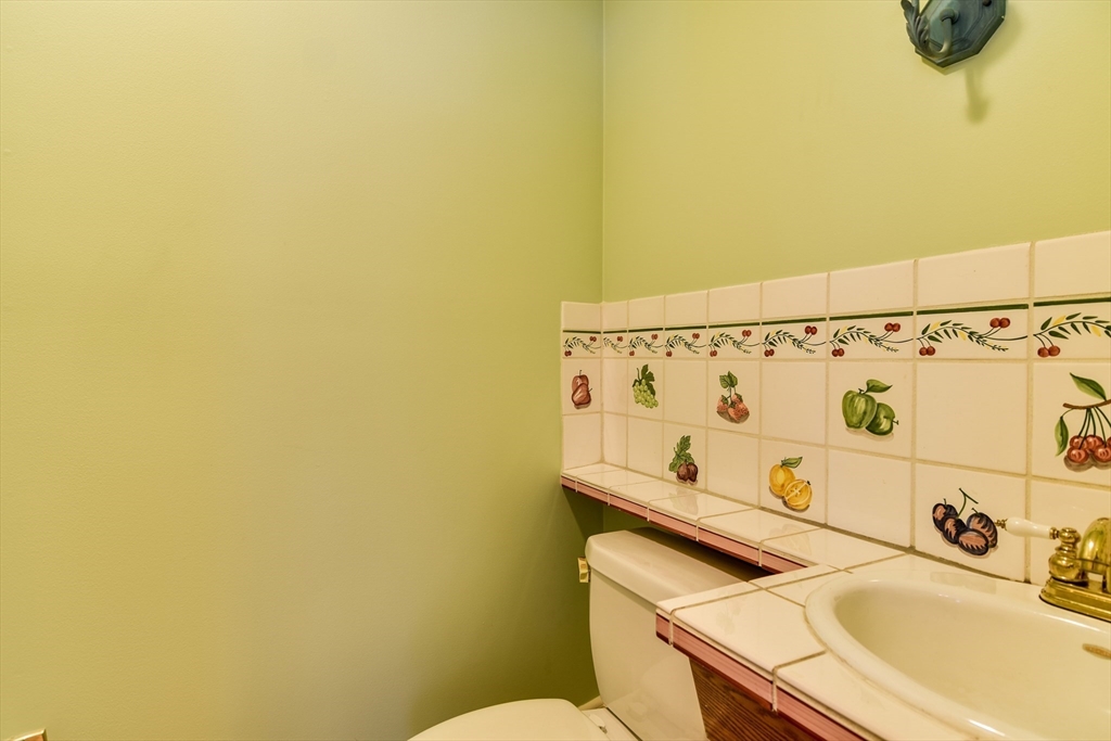 9 Buttercup Lane Dover, MA 02030 - Photo 18 of 36 a bathroom with a sink and a shower curtain