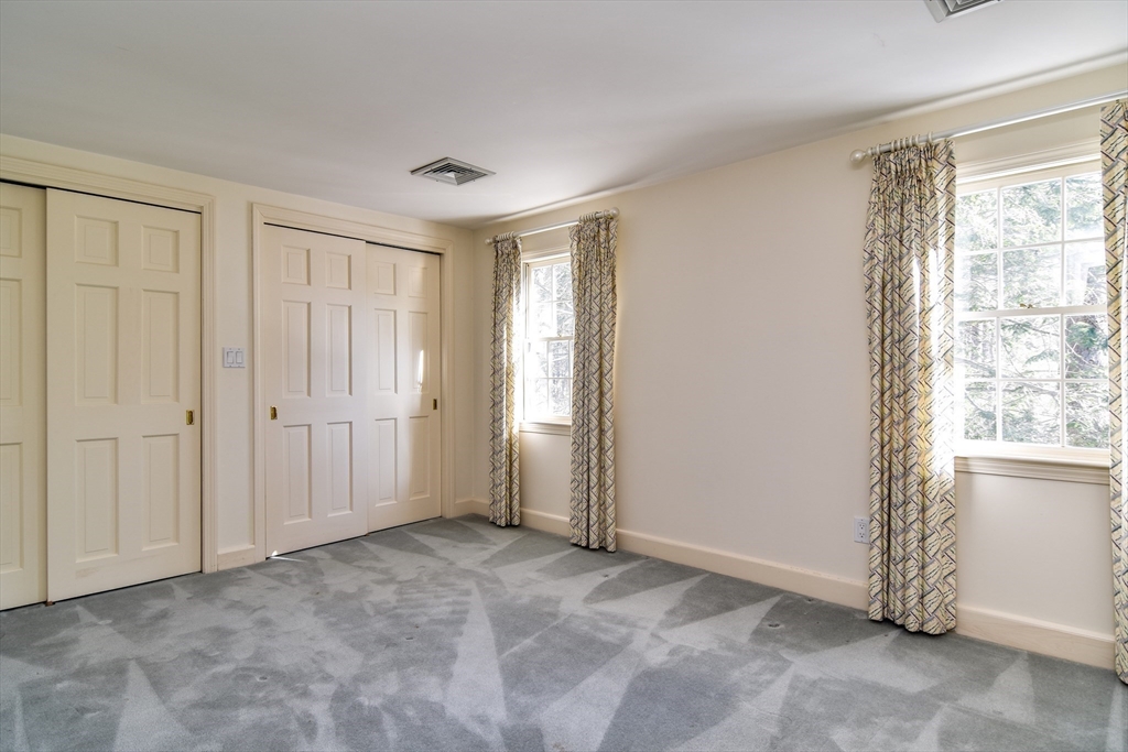 9 Buttercup Lane Dover, MA 02030 - Photo 21 of 36 a view of an empty room with a window