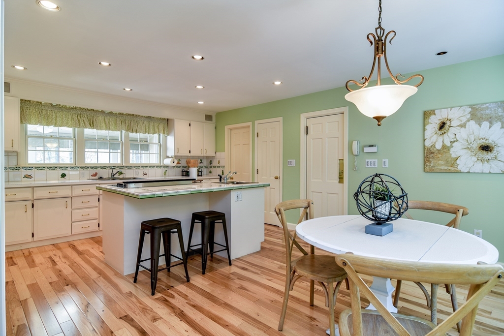 9 Buttercup Lane Dover, MA 02030 - Photo 3 of 36 a kitchen with granite countertop white cabinets and stainless steel appliances