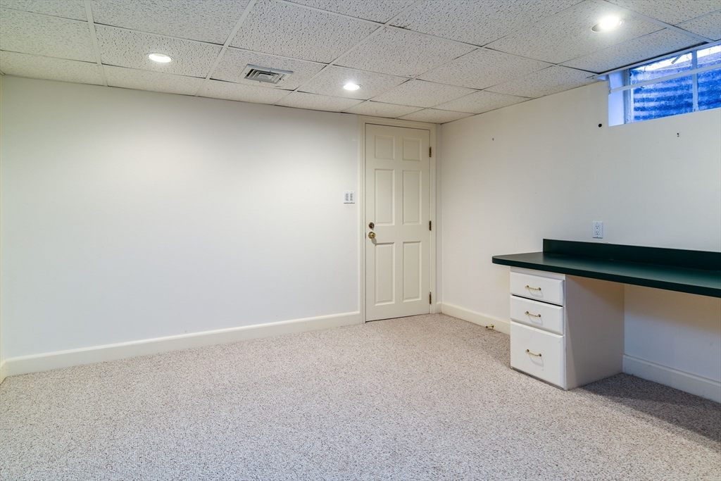 9 Buttercup Lane Dover, MA 02030 - Photo 31 of 36 a kitchen with white cabinets and white appliances