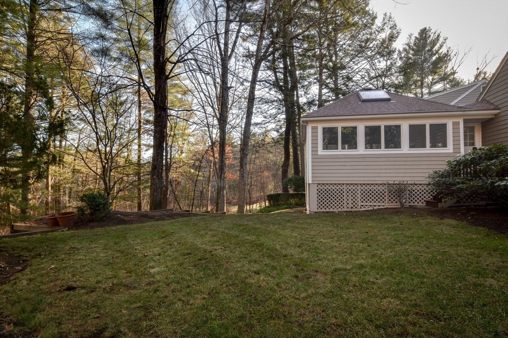9 Buttercup Lane Dover, MA 02030 - Photo 33 of 36 a view of a yard in front of a house with large tree
