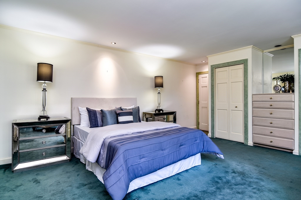 9 Buttercup Lane Dover, MA 02030 - Photo 5 of 36 a bedroom with a bed and a night stand