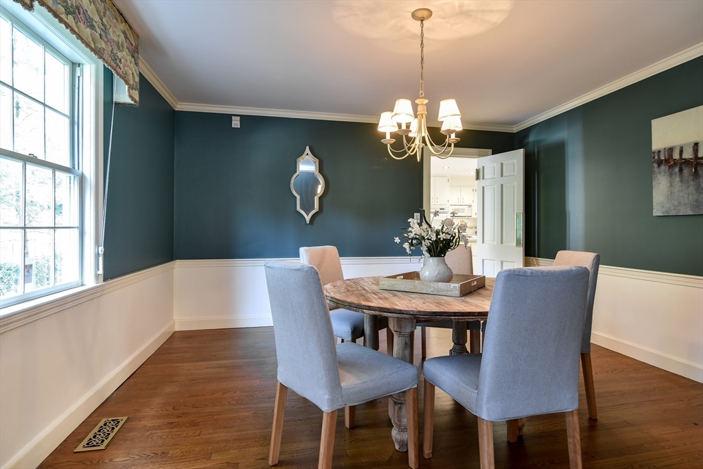 9 Buttercup Lane Dover, MA 02030 - Photo 6 of 36 a view of a dining room with furniture a chandelier and wooden floor