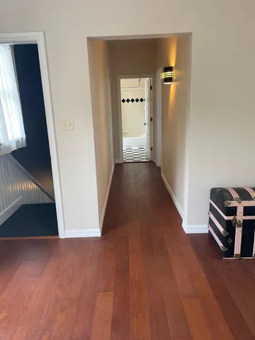 a dining room with furniture and a window