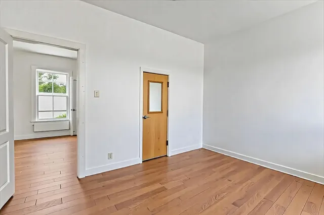 a view of balcony with wooden floor