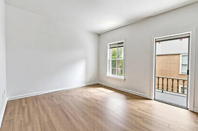 a view of a balcony with wooden floor