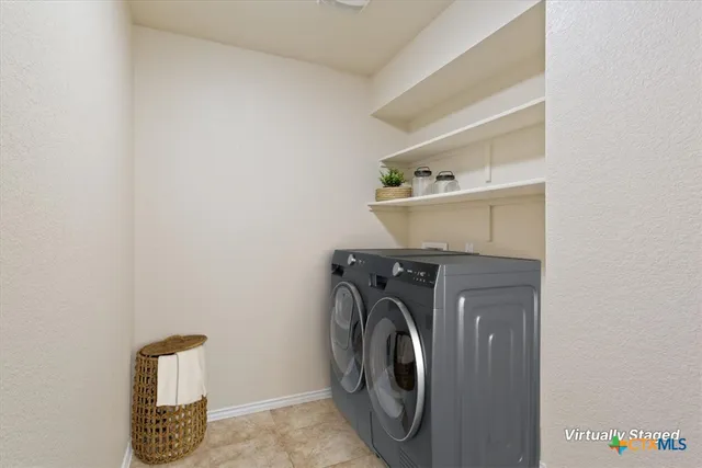 a swimming pool with lawn chairs and a yard