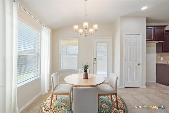 a kitchen with a refrigerator stove top oven and sink