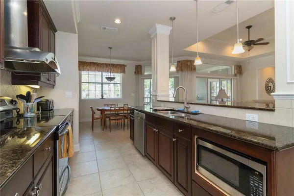 a kitchen with lots of counter top space and appliances