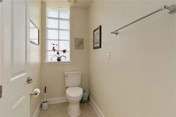 a white toilet sitting next to a bathroom sink