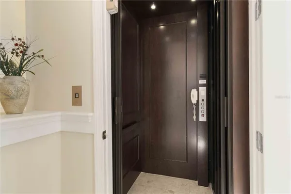 a bathroom with a glass shower door
