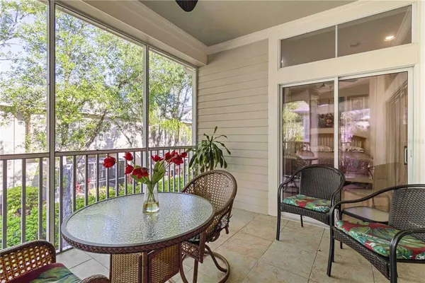 a backyard of a house with table and chairs