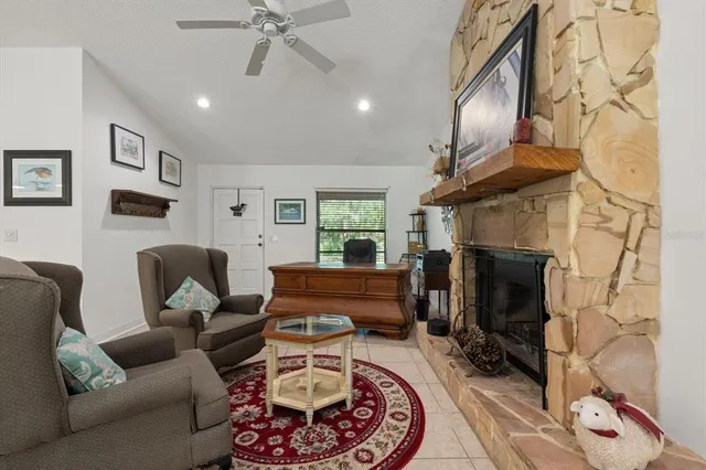 a bedroom with a large bed and a potted plant