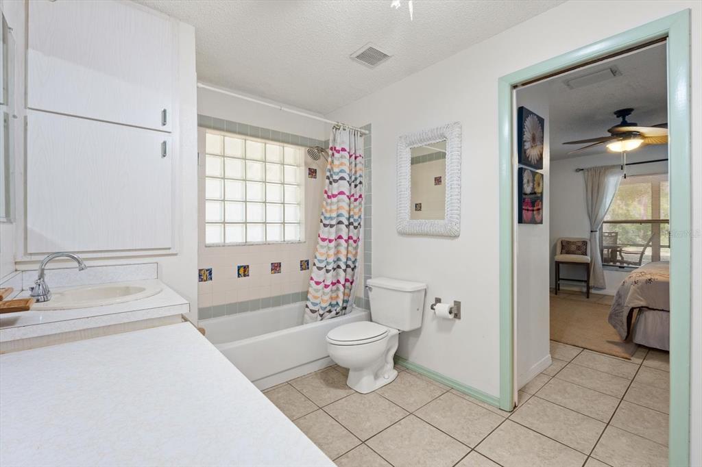 13719 Seminole Trail Wimauma, FL 33598 - Photo 28 of 68 a bathroom with a sink a toilet and shower