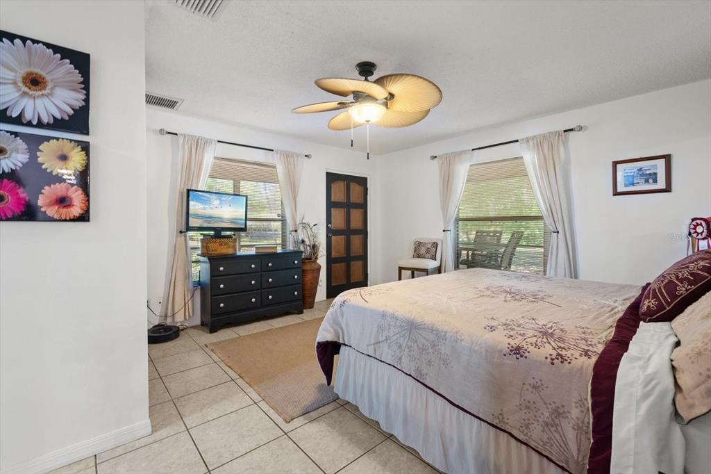 13719 Seminole Trail Wimauma, FL 33598 - Photo 29 of 68 a bedroom with a bed and a dresser