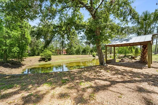 a view of a lake with a yard
