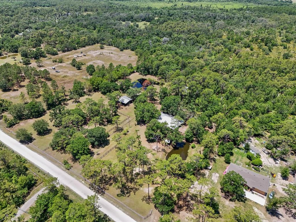 13719 Seminole Trail Wimauma, FL 33598 - Photo 56 of 68 an aerial view of a house with a yard