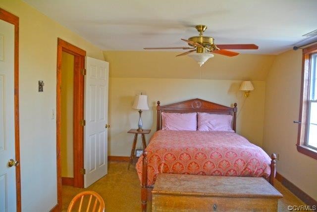 399 Chellowe Road Dillwyn, VA 23936 - Photo 17 of 50 a bedroom with a bed and a chandelier