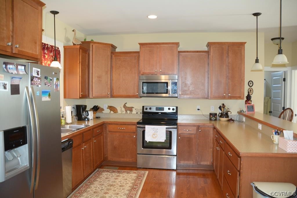 399 Chellowe Road Dillwyn, VA 23936 - Photo 39 of 50 a kitchen with stainless steel appliances granite countertop a sink stove and refrigerator