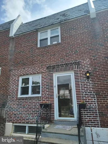 a building view with a brick wall