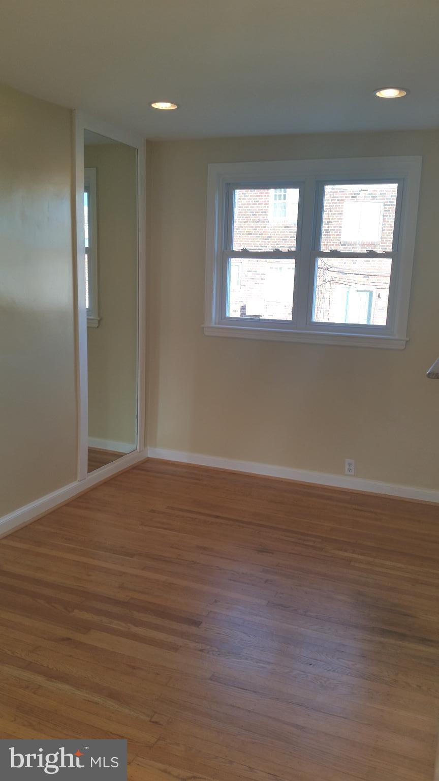 3612 Winona Street Philadelphia, PA 19129 - Photo 6 of 10 a view of an empty room with wooden floor and windows