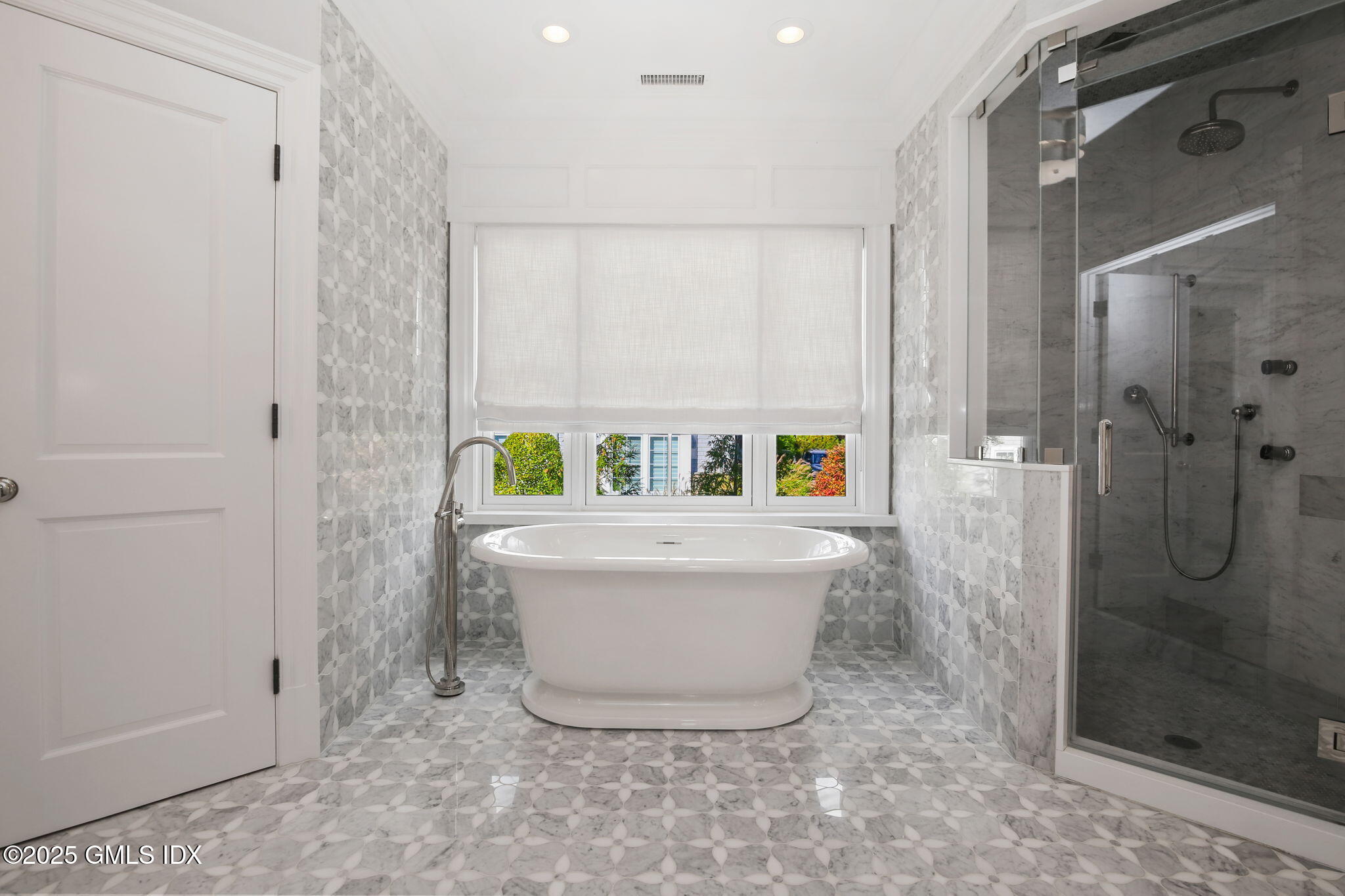 50 Sound View Drive, Unit 4N Greenwich, CT 06830 - Photo 11 of 20 a bathroom with a bathtub and shower