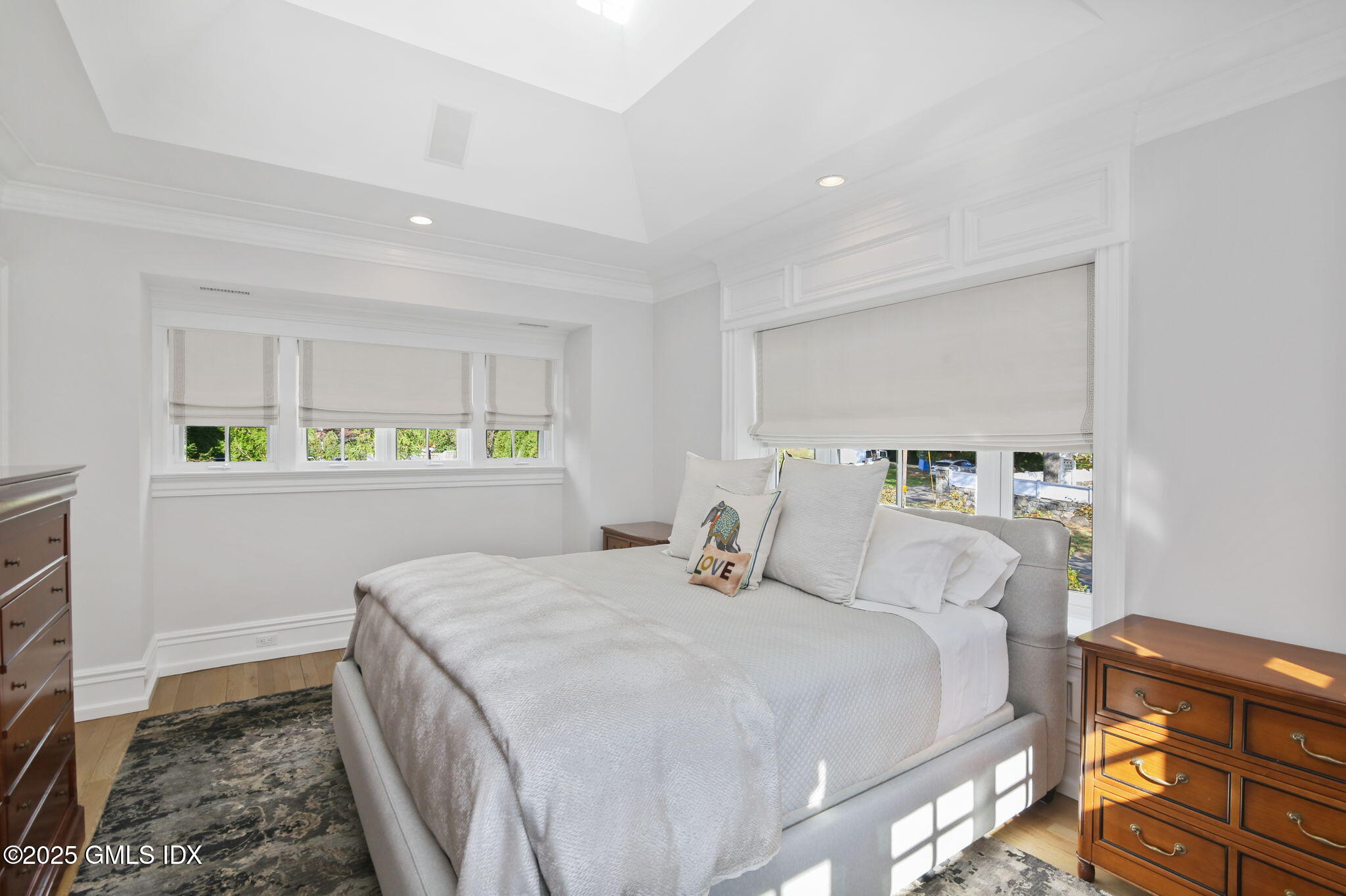 50 Sound View Drive, Unit 4N Greenwich, CT 06830 - Photo 12 of 20 a bedroom with a bed and a dresser