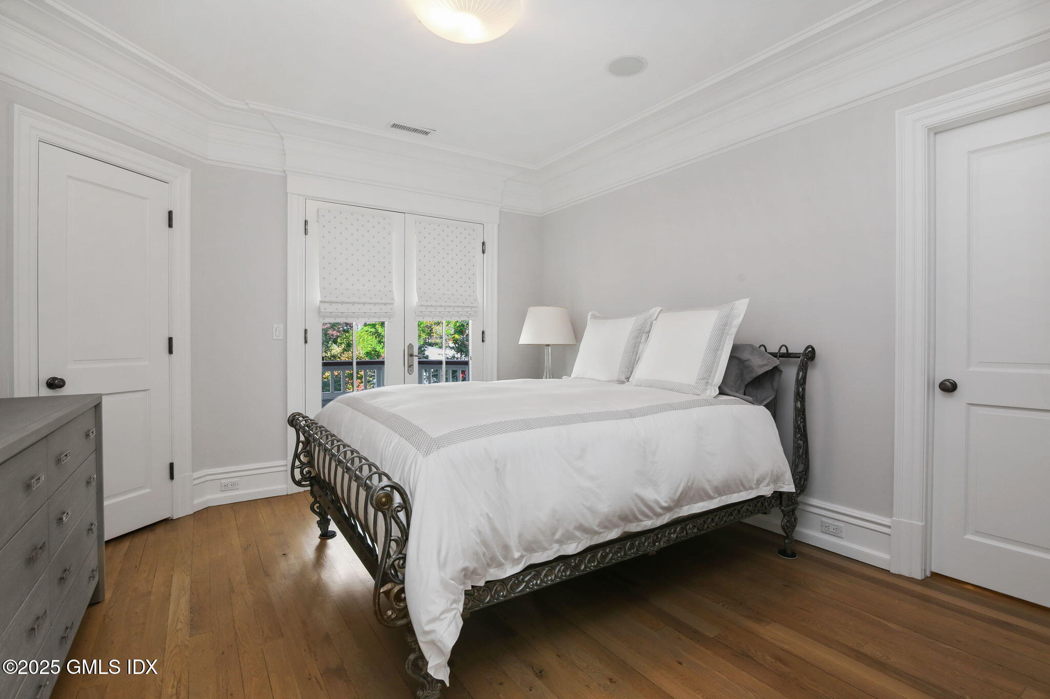 50 Sound View Drive, Unit 4N Greenwich, CT 06830 - Photo 13 of 20 a bedroom with a bed and a closet