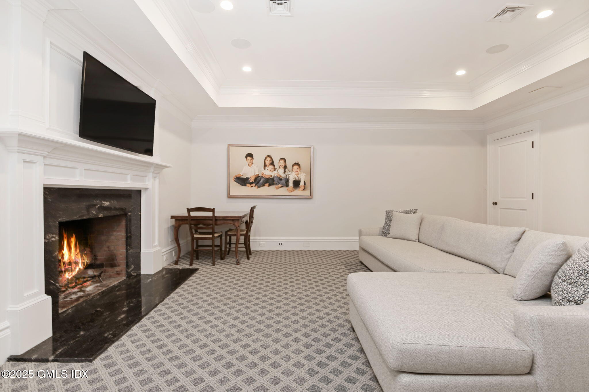 50 Sound View Drive, Unit 4N Greenwich, CT 06830 - Photo 15 of 20 a living room with furniture and a fireplace