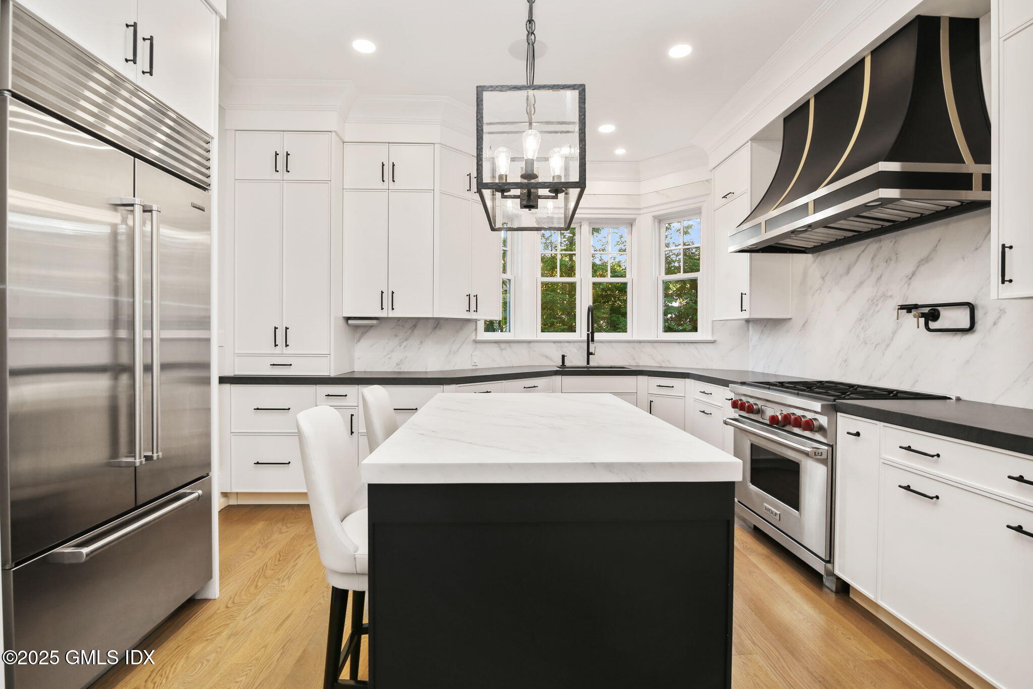 50 Sound View Drive, Unit 4N Greenwich, CT 06830 - Photo 6 of 20 a kitchen with stainless steel appliances granite countertop a sink stove and refrigerator