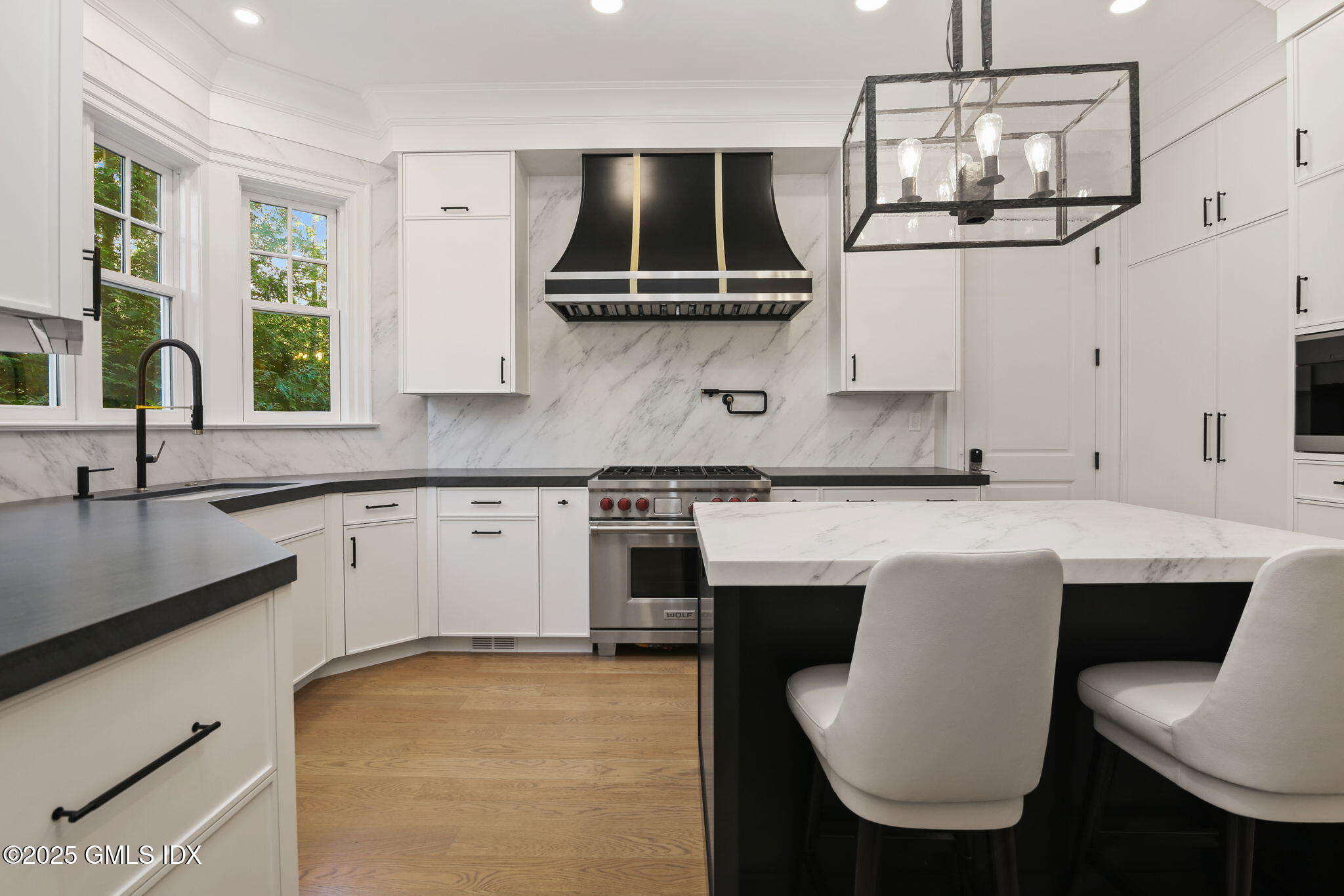 50 Sound View Drive, Unit 4N Greenwich, CT 06830 - Photo 7 of 20 a kitchen with stainless steel appliances granite countertop a sink and stove