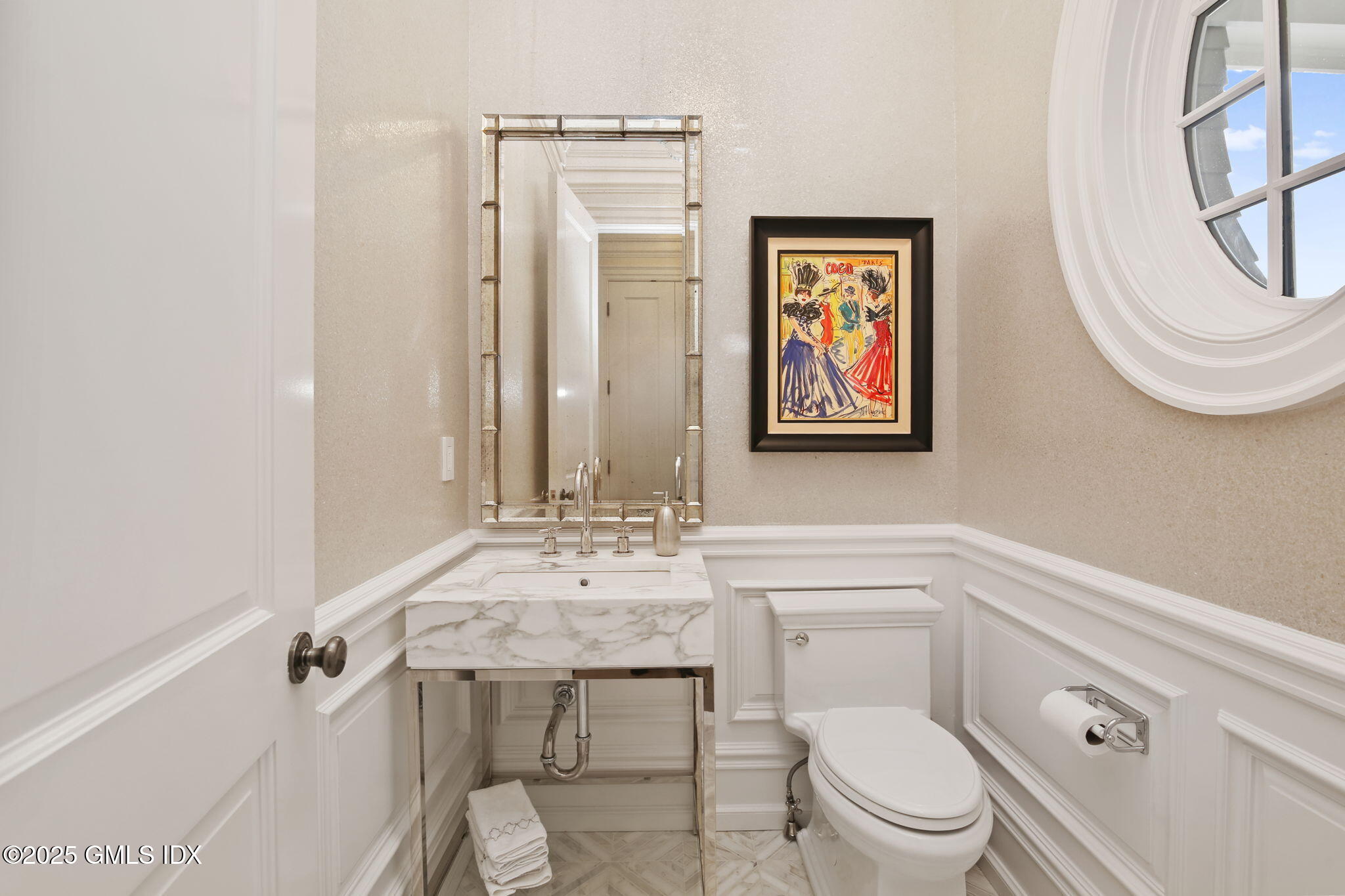 50 Sound View Drive, Unit 4N Greenwich, CT 06830 - Photo 8 of 20 a bathroom with a toilet a sink and mirror