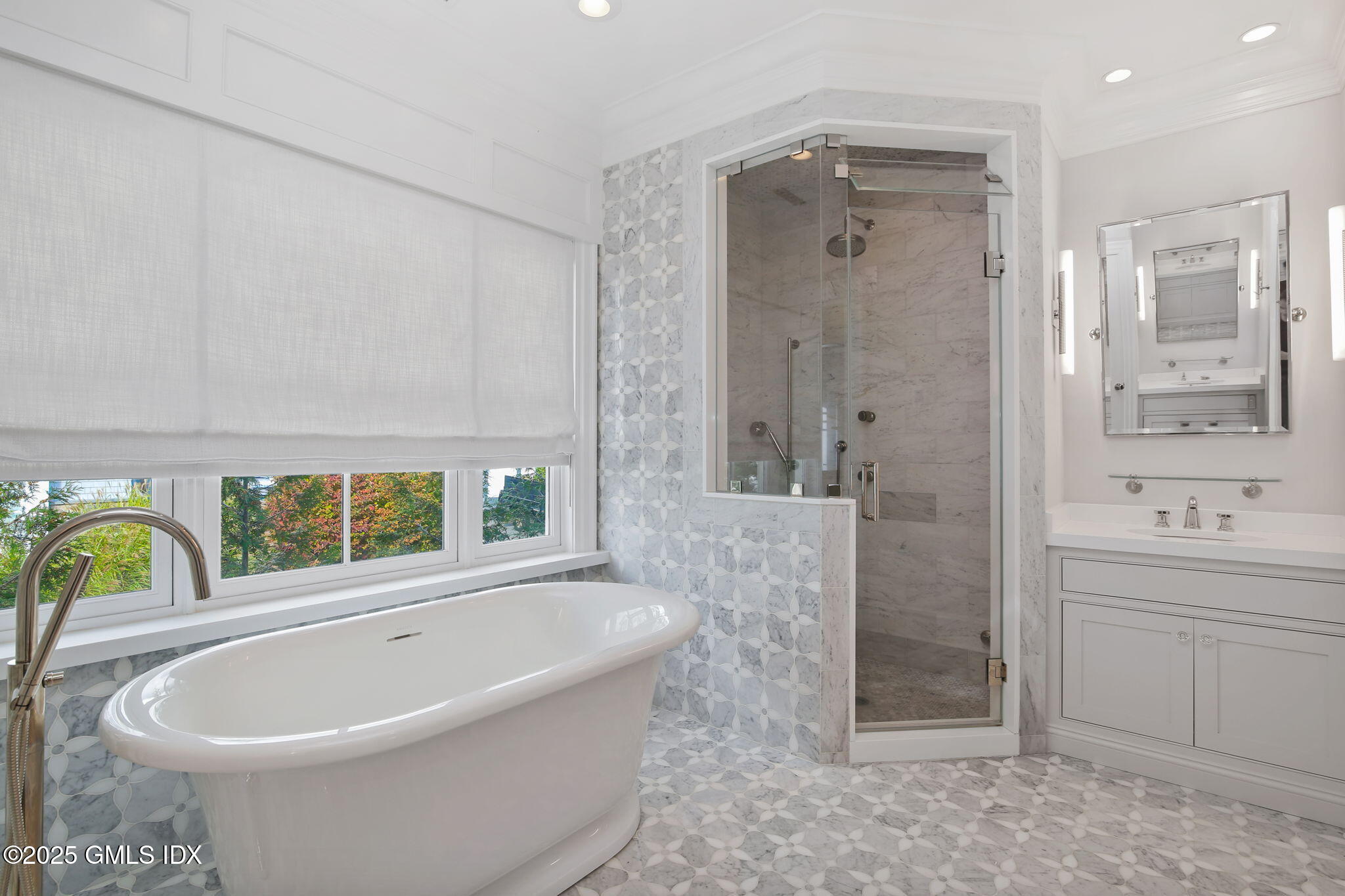 50 Sound View Drive, Unit 4N Greenwich, CT 06830 - Photo 10 of 20 a bathroom with a bathtub a sink and a shower