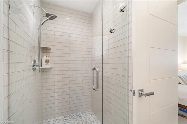 a bedroom with two beds and painted walls