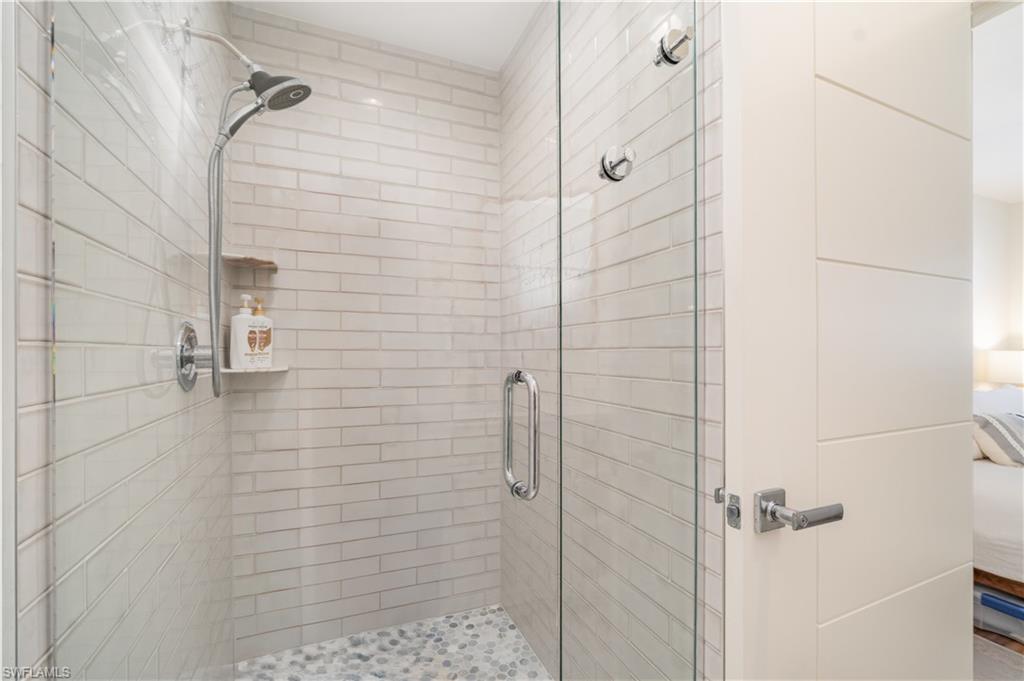 473 12th Avenue South, Unit B11 Naples, FL 34102 - Photo 11 of 18 a bathroom with a shower