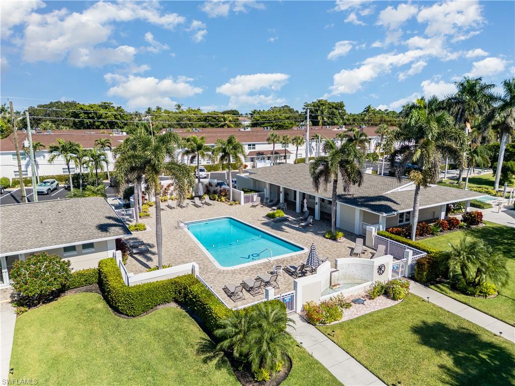 473 12th Avenue South, Unit B11 Naples, FL 34102 - Photo 15 of 18 an aerial view of a house with swimming pool and big yard