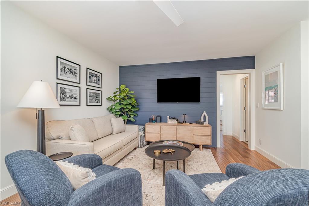 473 12th Avenue South, Unit B11 Naples, FL 34102 - Photo 7 of 18 a living room with furniture and a flat screen tv