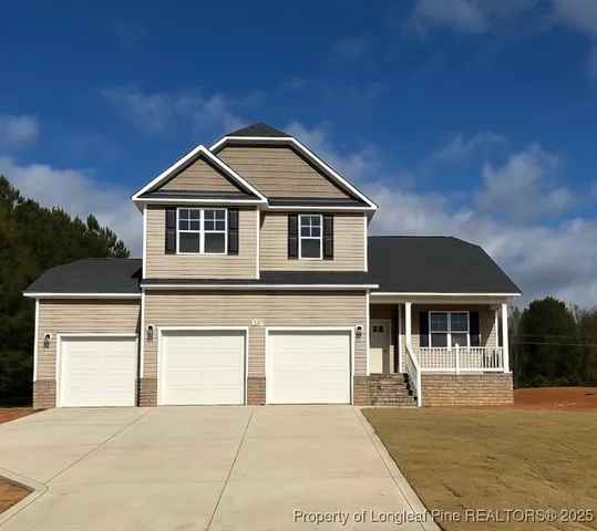 a front view of a house with yard